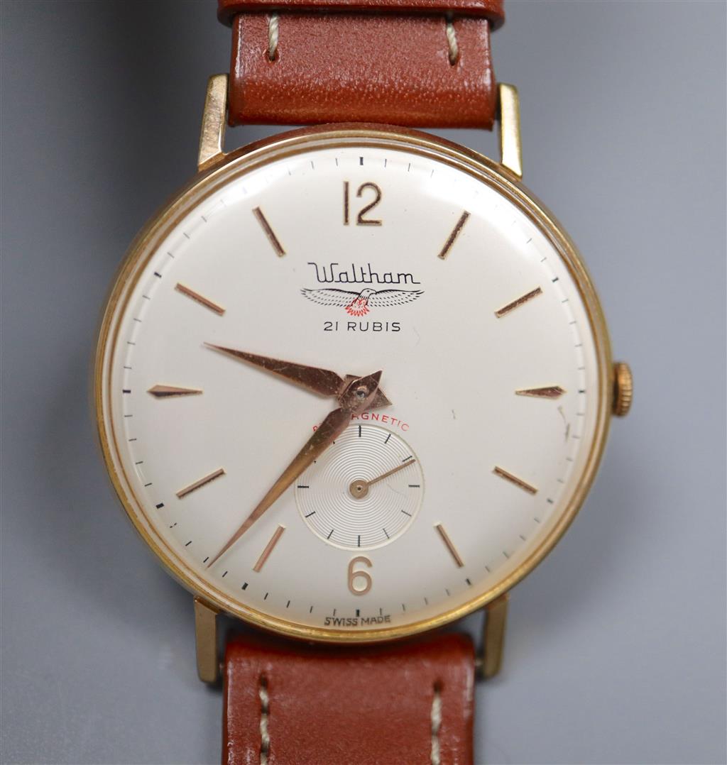 A gentlemans yellow metal and steel Waltham manual wind wrist watch, on later leather strap.